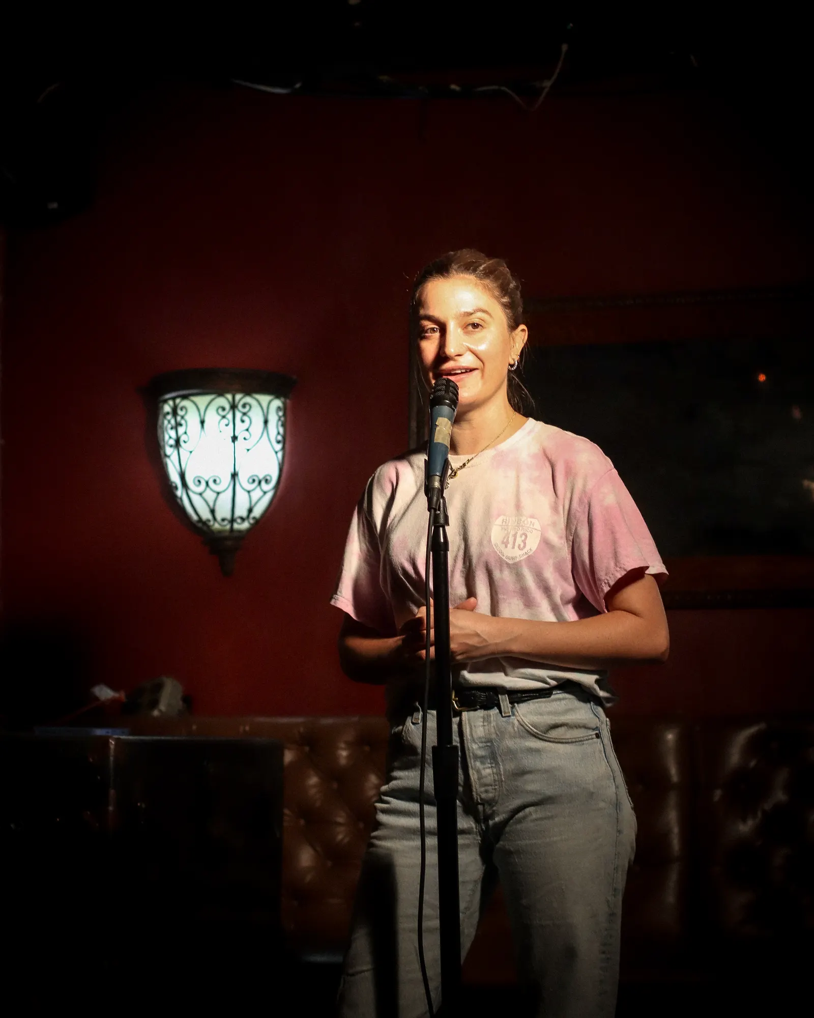 Comedian at the mic on the Upper East Side Comedy Club stage at Bedford Falls NYC